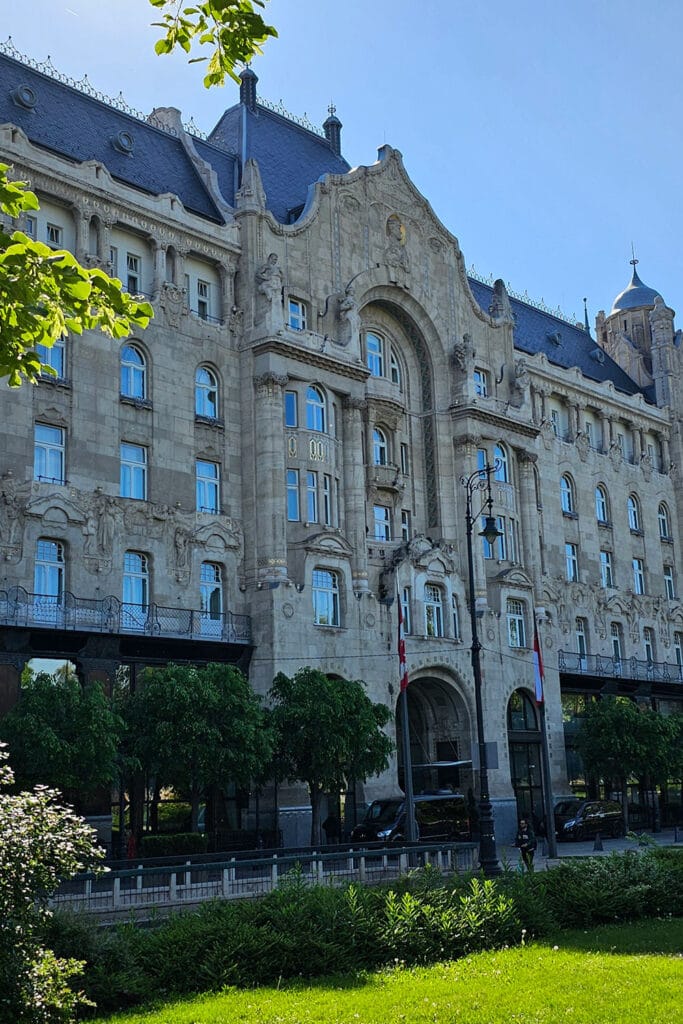 the building of the Four Seasons Hotel Gresham Palace in Budapest on a sunny summer day