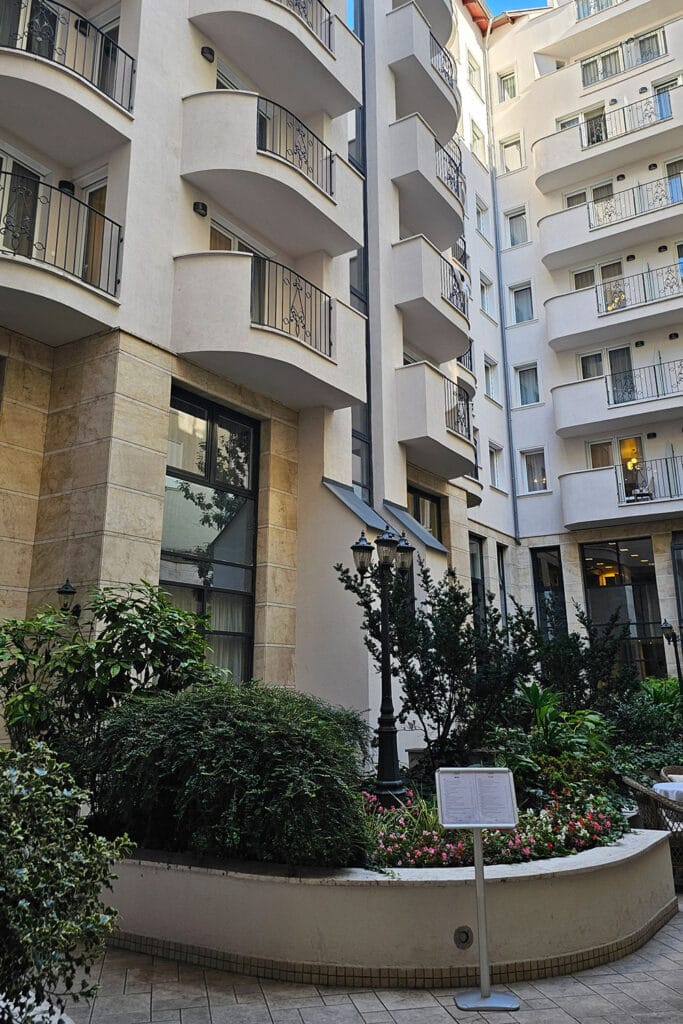 the garden of Queen’s Court Hotel & Residence