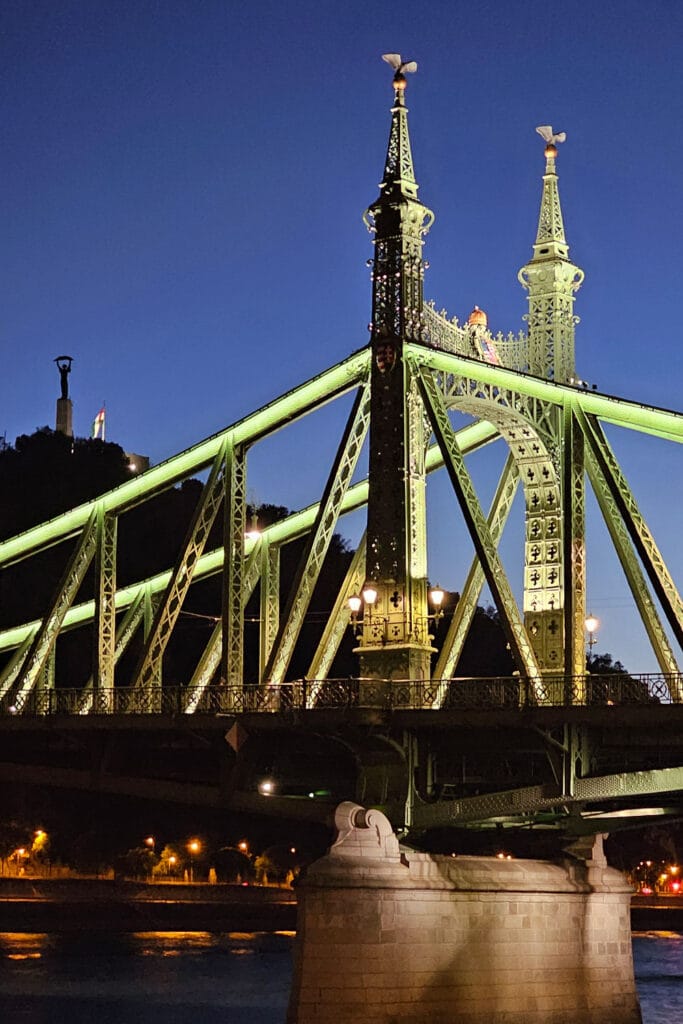 Liberty Bridge in the evening with the Liberty Statue and Citadel in the background