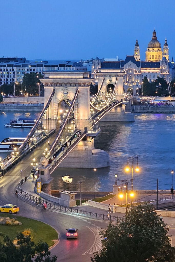 Chain Bridge at night with the Gresham Palace and Basilica in the background