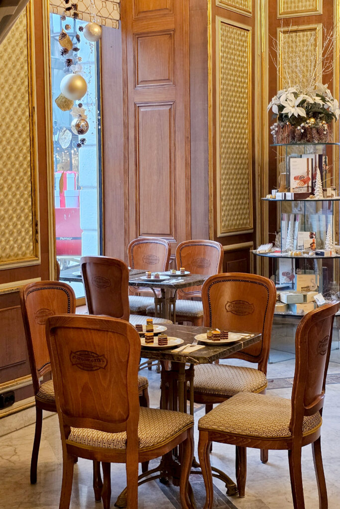 wooden chairs inside Gerbeaud Cafe
