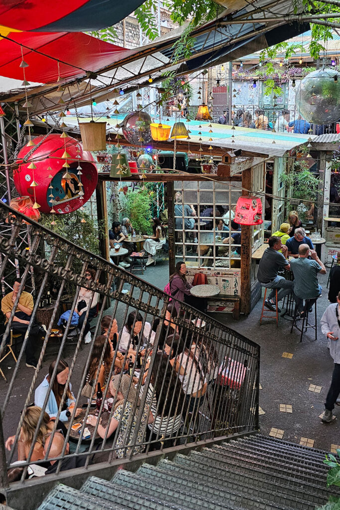 people in a ruin bar in Budapest in the afternoon