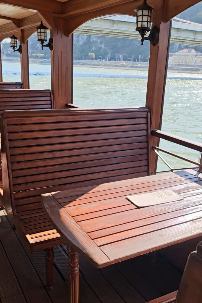 wooden benches in the covered passenger area on Kisfaludy paddle steamer