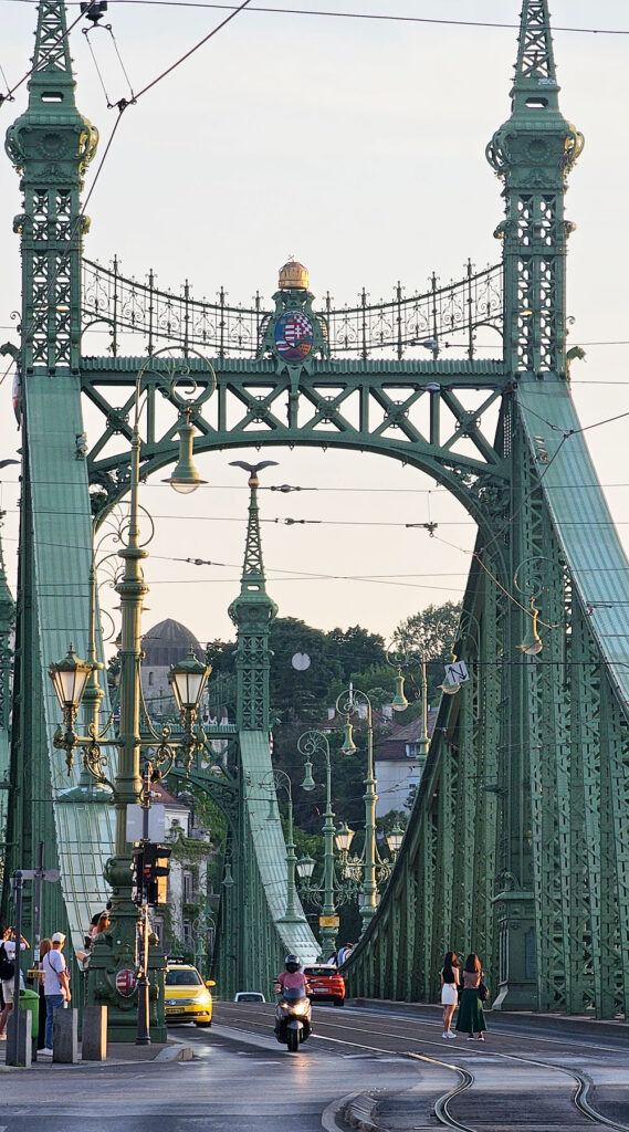 people gather around Liberty Bridge