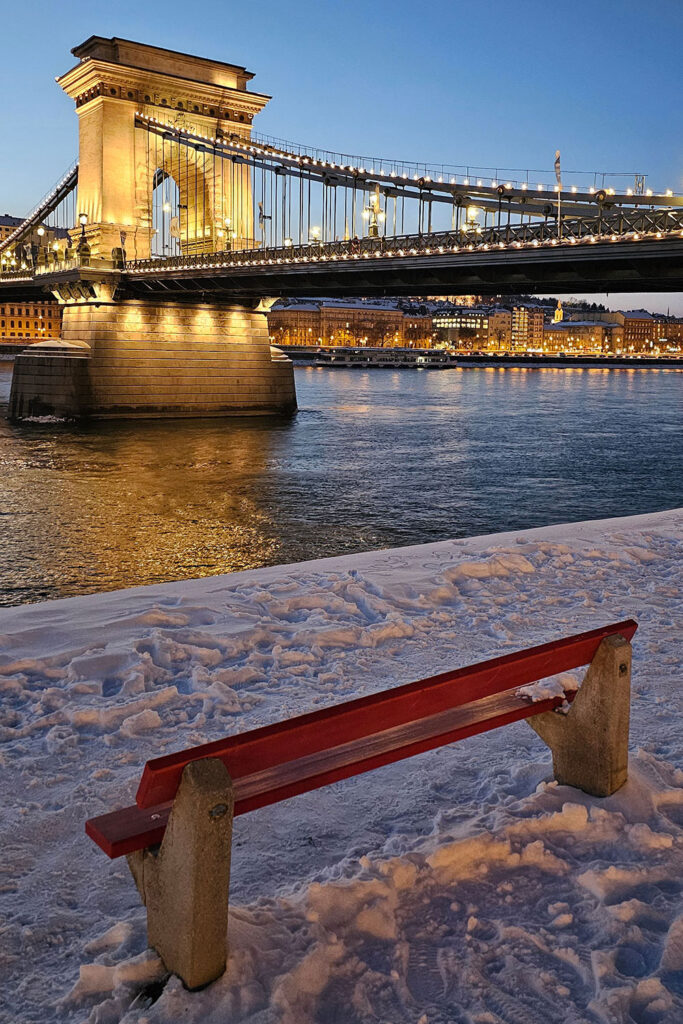 red bench photo spot next to Chain Bridge